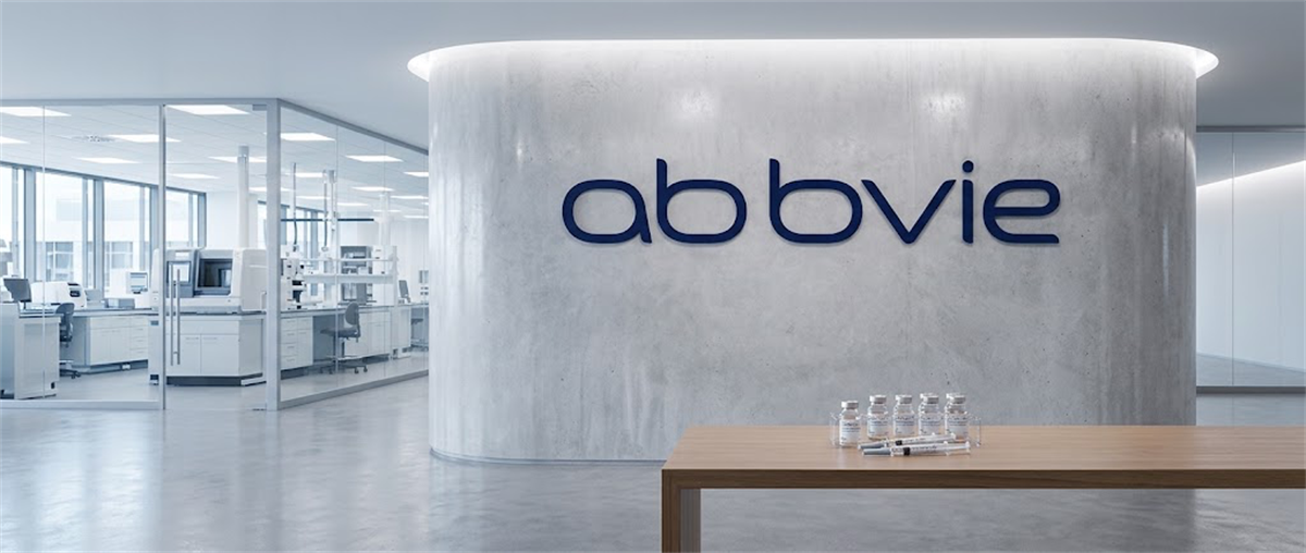 AbbVie logo on a curved wall in an office lobby, with a laboratory and vials visible nearby.