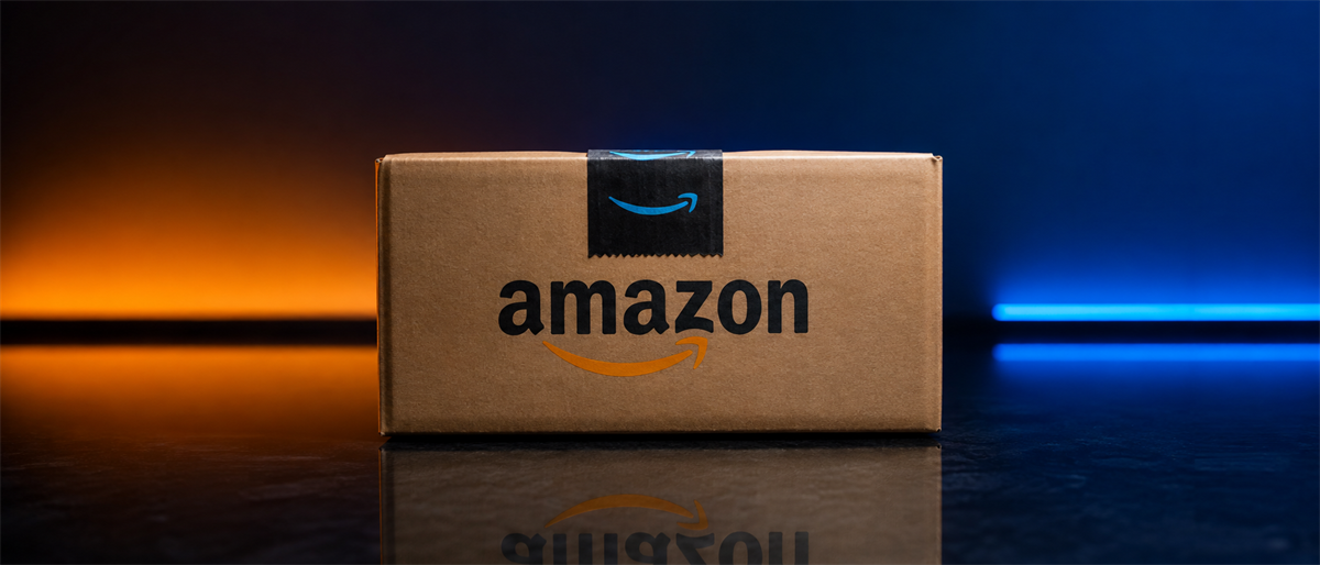 A cardboard Amazon delivery box with the Amazon logo sits on a reflective surface lit by orange and blue lighting.