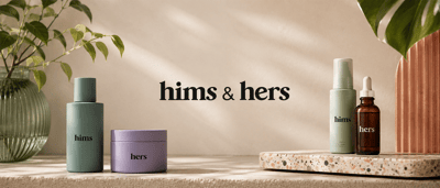Hims & Hers Health branded product packaging displayed on a table, including bottles labeled "hims" and "hers".