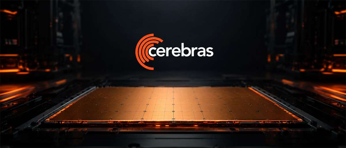 Cerebras logo above a large computer chip, illuminated with an orange glow in a dark server room setting.