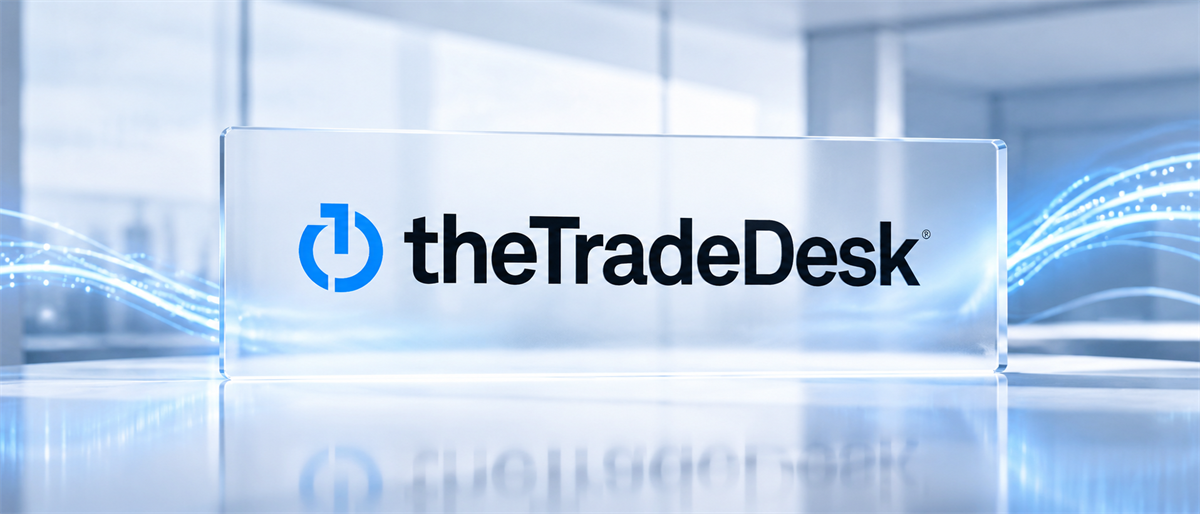 The Trade Desk logo displayed on a glass panel against a blue abstract digital background.