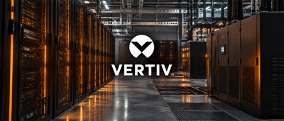 Vertiv logo displayed in a data center aisle lined with server racks and power equipment.