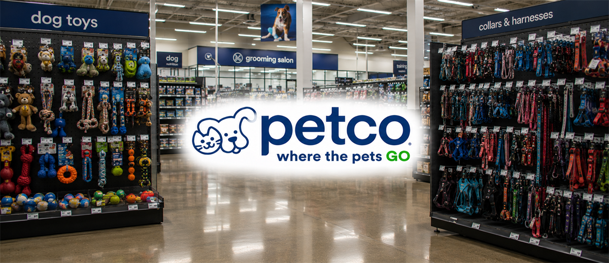 Interior of a Petco store showing dog toys and collar aisles with the Petco logo overlaid.