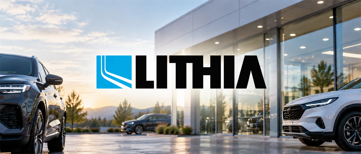 Lithia logo displayed over a car dealership showroom with vehicles parked in front of the glass building.