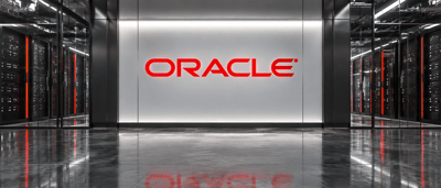 Oracle logo illuminated on a wall inside a data center corridor lined with server racks.