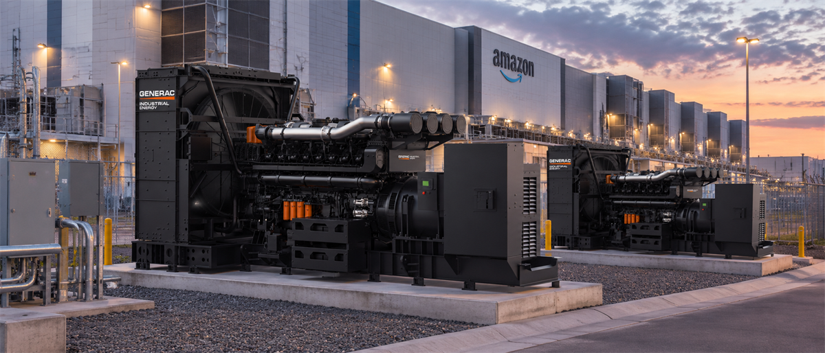 Generac industrial energy generators installed outside an Amazon data center building at dusk.
