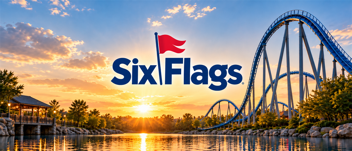 Six Flags logo displayed over a roller coaster and lake at sunset in an amusement park setting.