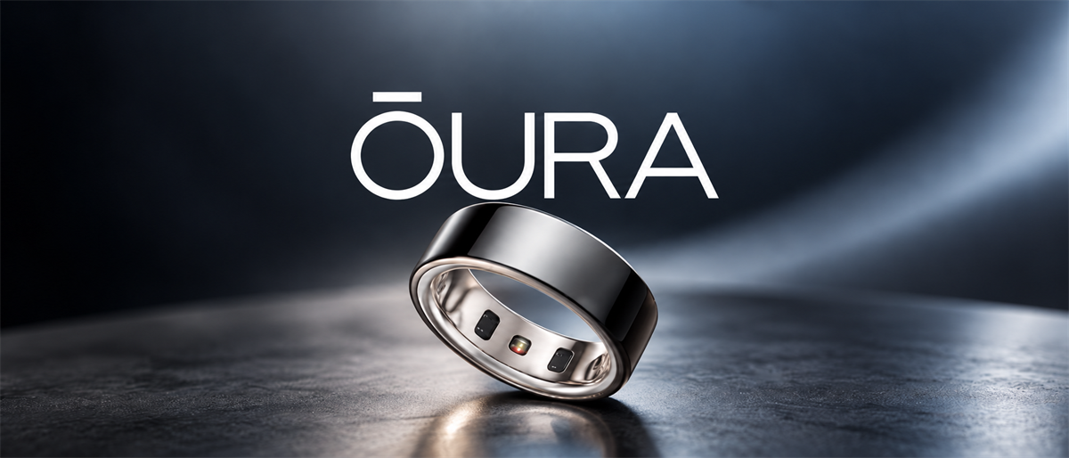 Oura logo above a black smart ring with sensors, shown standing upright on a dark reflective surface.