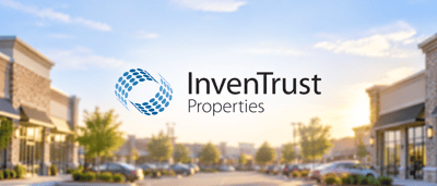 InvenTrust Properties logo displayed over a blurred background of a retail shopping center parking lot.