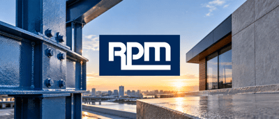 RPM International logo displayed over a construction scene with steel beams and a modern building exterior at sunset.