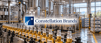 Constellation Brands logo over a bottling facility with Corona Extra bottles on a conveyor line.