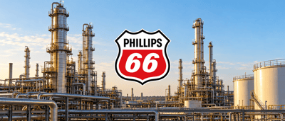 Phillips 66 logo shown in front of an oil refinery with distillation towers and storage tanks.