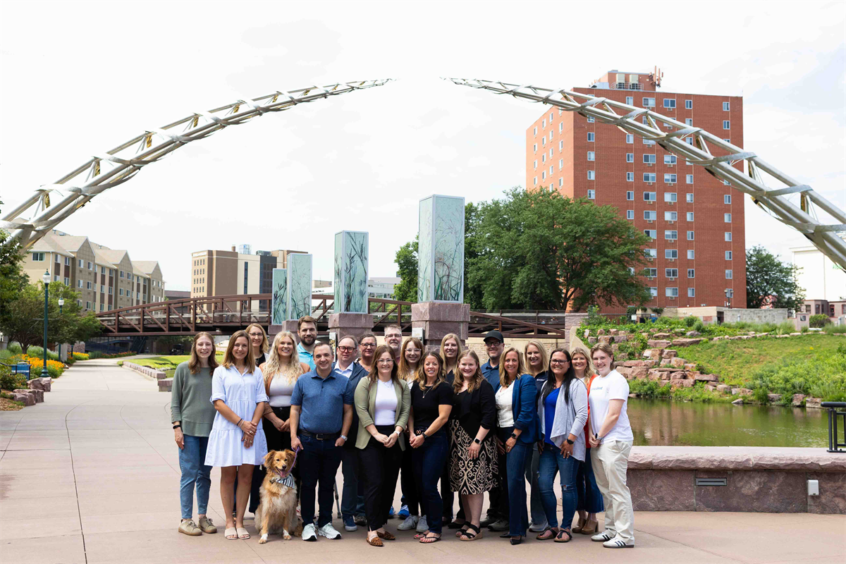 MarketBeat group photo under arc of dreams