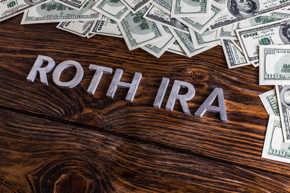 How many Roth IRAs can you have? The words ROTH IRA laid on wooden surface with metal letters near money.