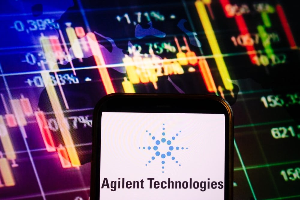 KONSKIE, POLAND - September 04, 2022: Smartphone displaying logo of Agilent Technologies company on stock exchange diagram background