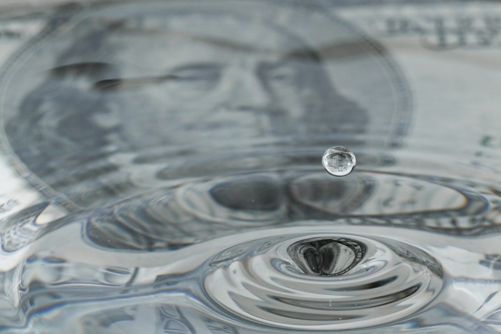 water drops and ripples with a one hundred dollar bill: What is market liquidity