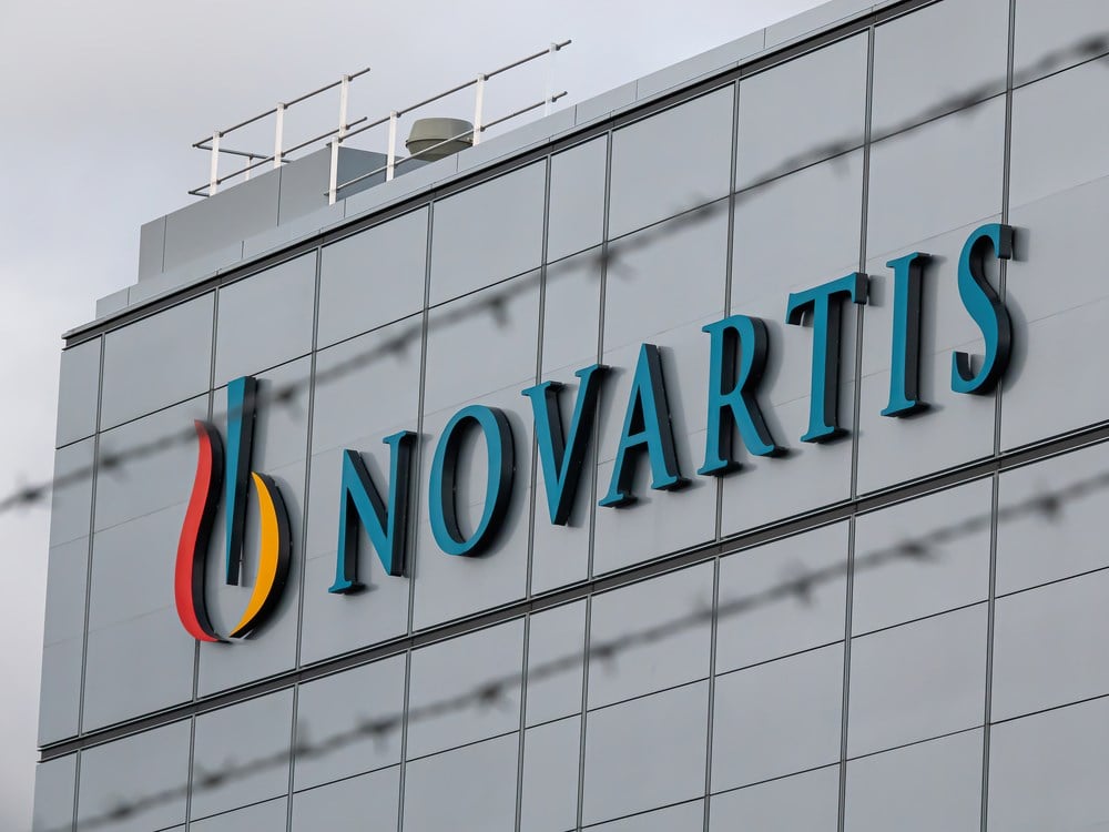 Novartis logo on the outside of a building: Learn more about Novartis stock