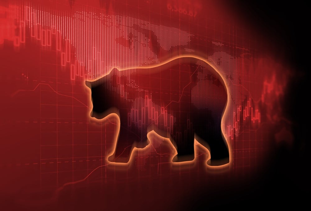 silhouette form of bear on financial stock market graph represent stock market crash or down trend investment