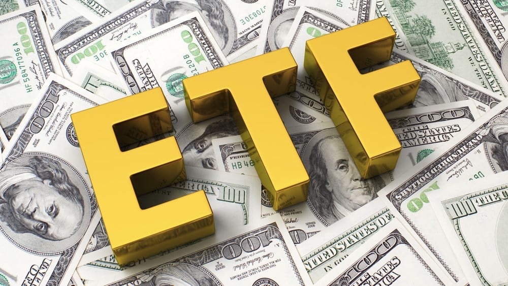 Abbreviation ETF on the background of one hundred dollar bills