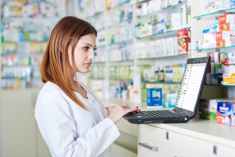 Pharmacist checking stock values; Pharma stocks overview.