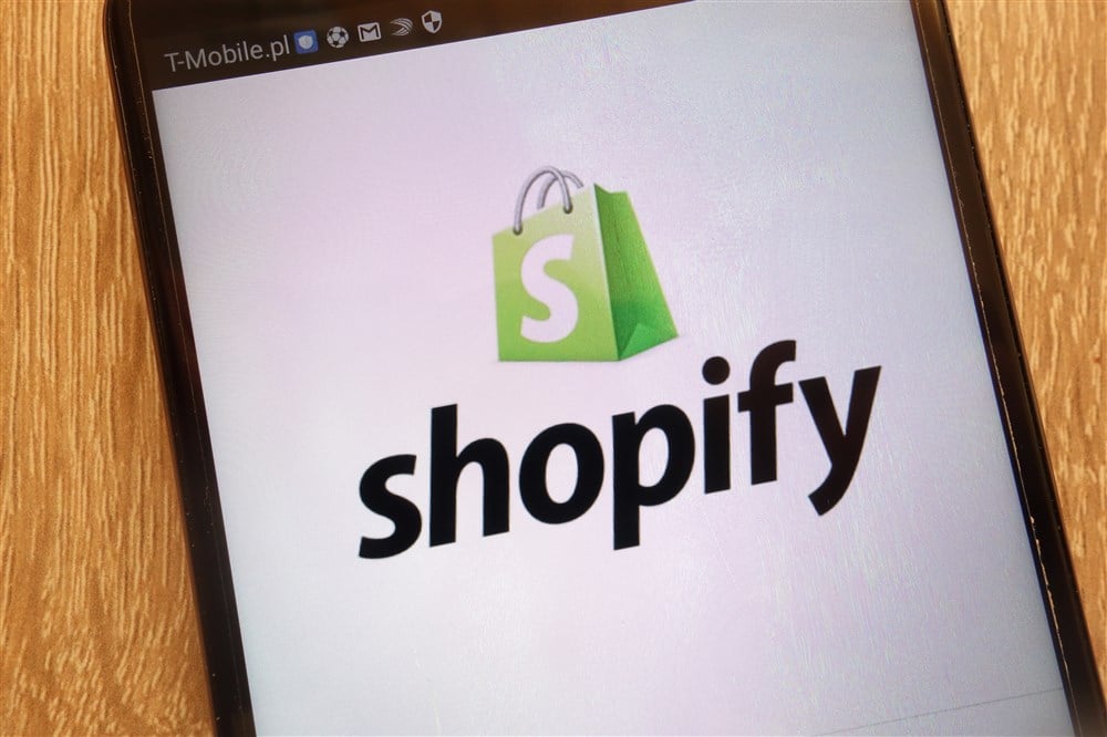 shopify logo on phone                