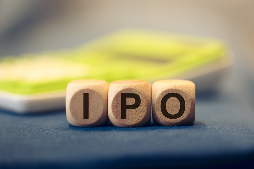 What is an initial public offering? IPO image with wooden blocks and calculator in the background