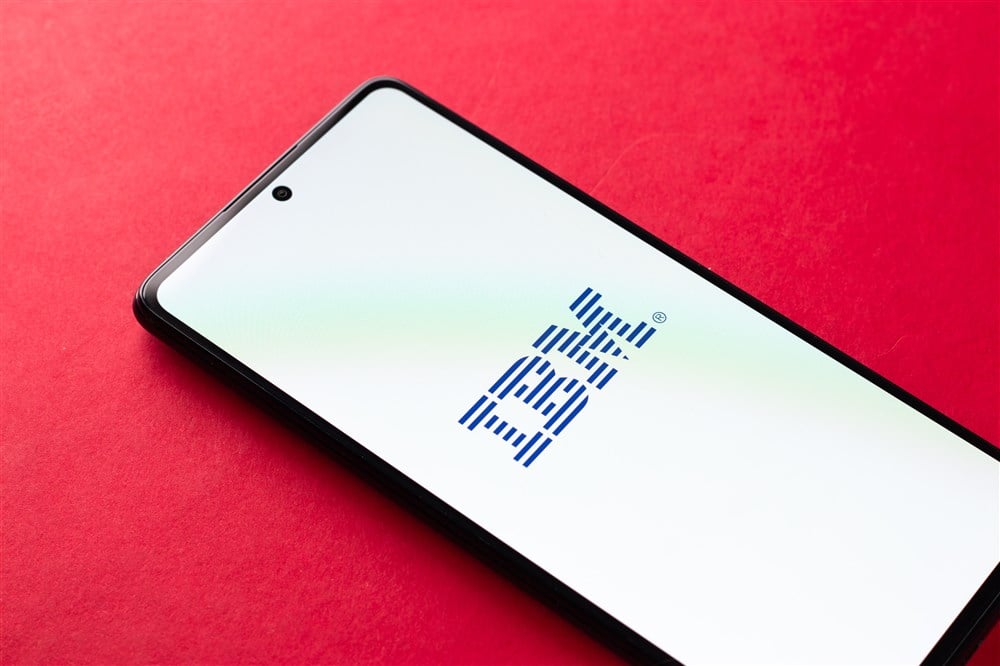 ibm logo on mobile device on red background
