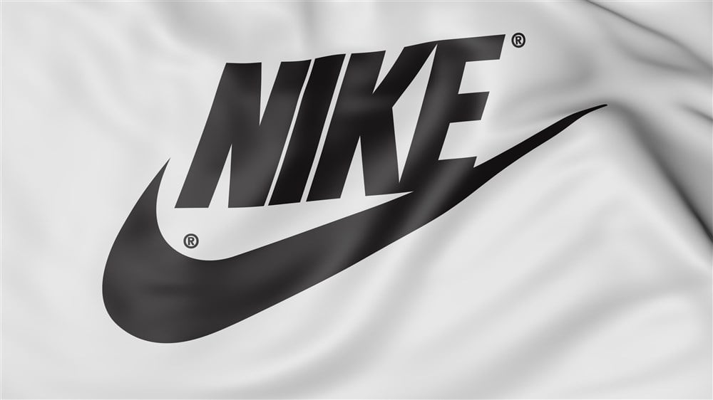 Black Nike logo on white fabric background