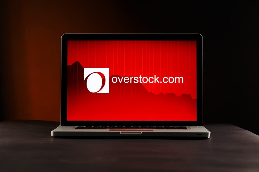 overstock.com text and logo displayed on red computer screen