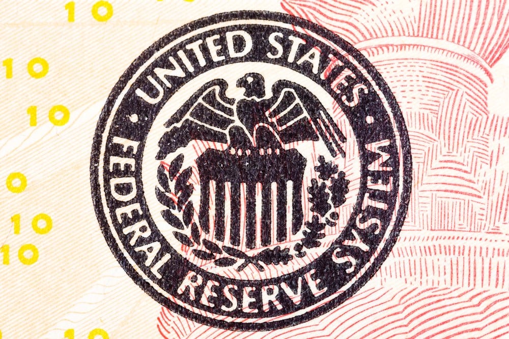 Federal Reserve icon on a dollar bill; the discount rate indicates a direction for monetary policy