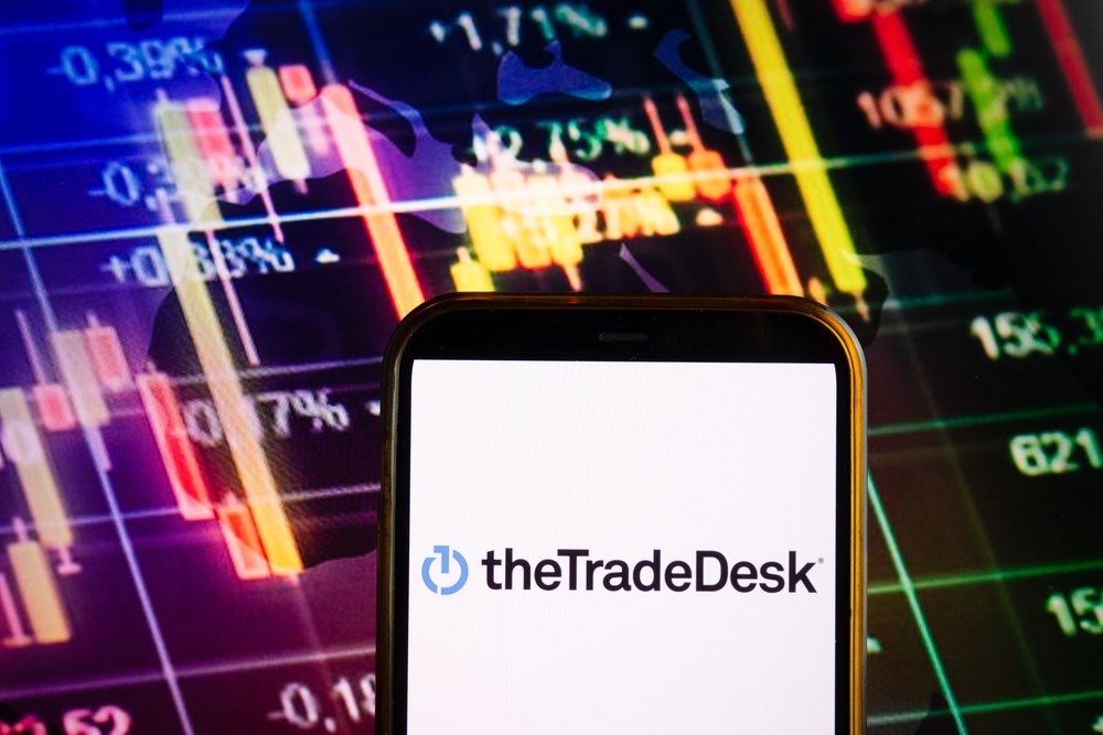 KONSKIE, POLAND - September 10, 2022: Smartphone displaying logo of The Trade Desk company on stock exchange diagram background