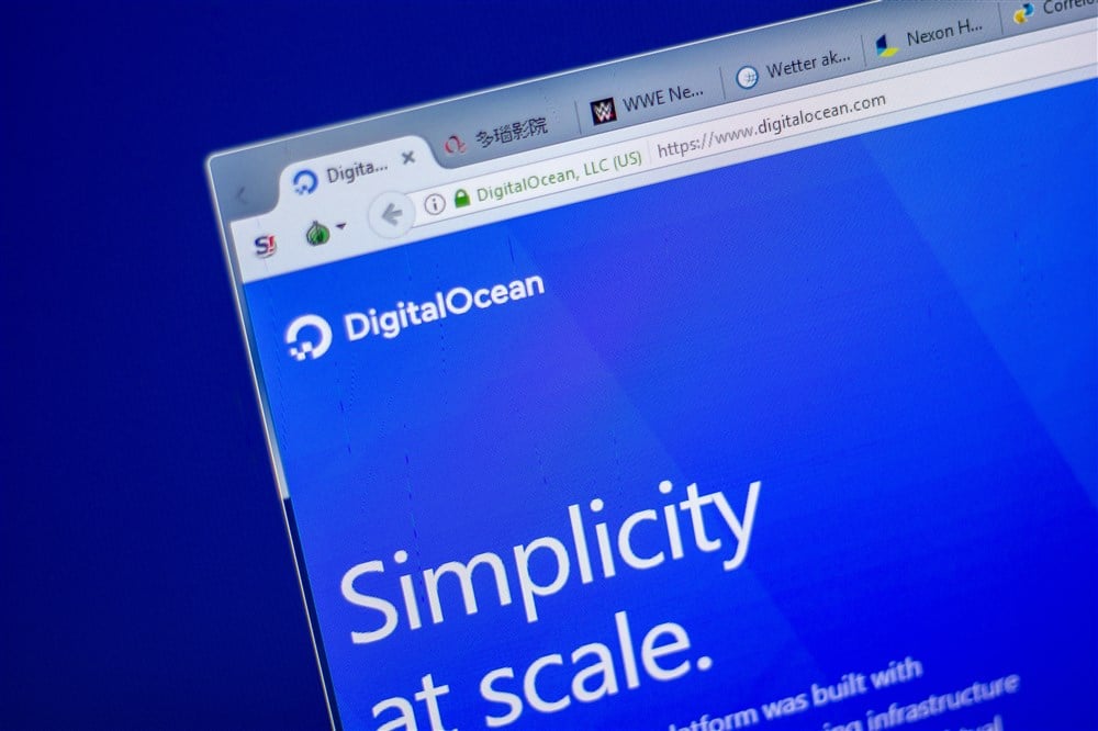 homepage of digitalocean website displayed on mobile device blue background