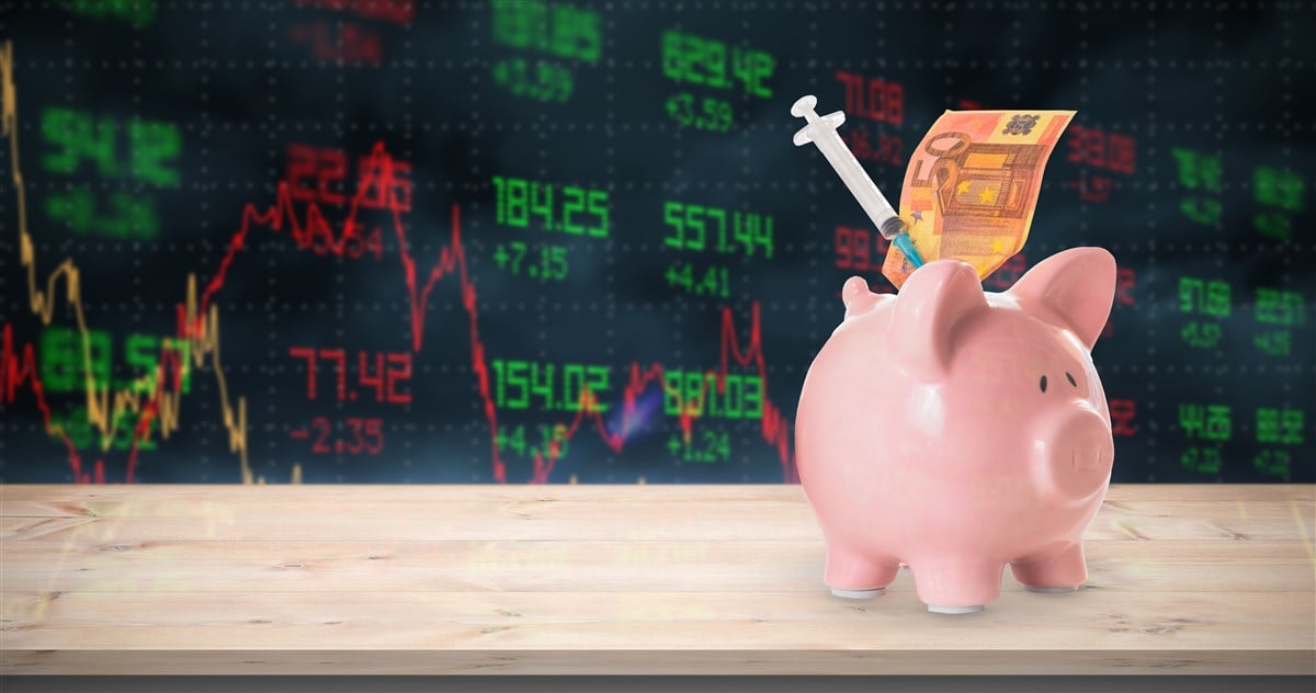photo of piggy bank with syringe and money implying dividend stocks