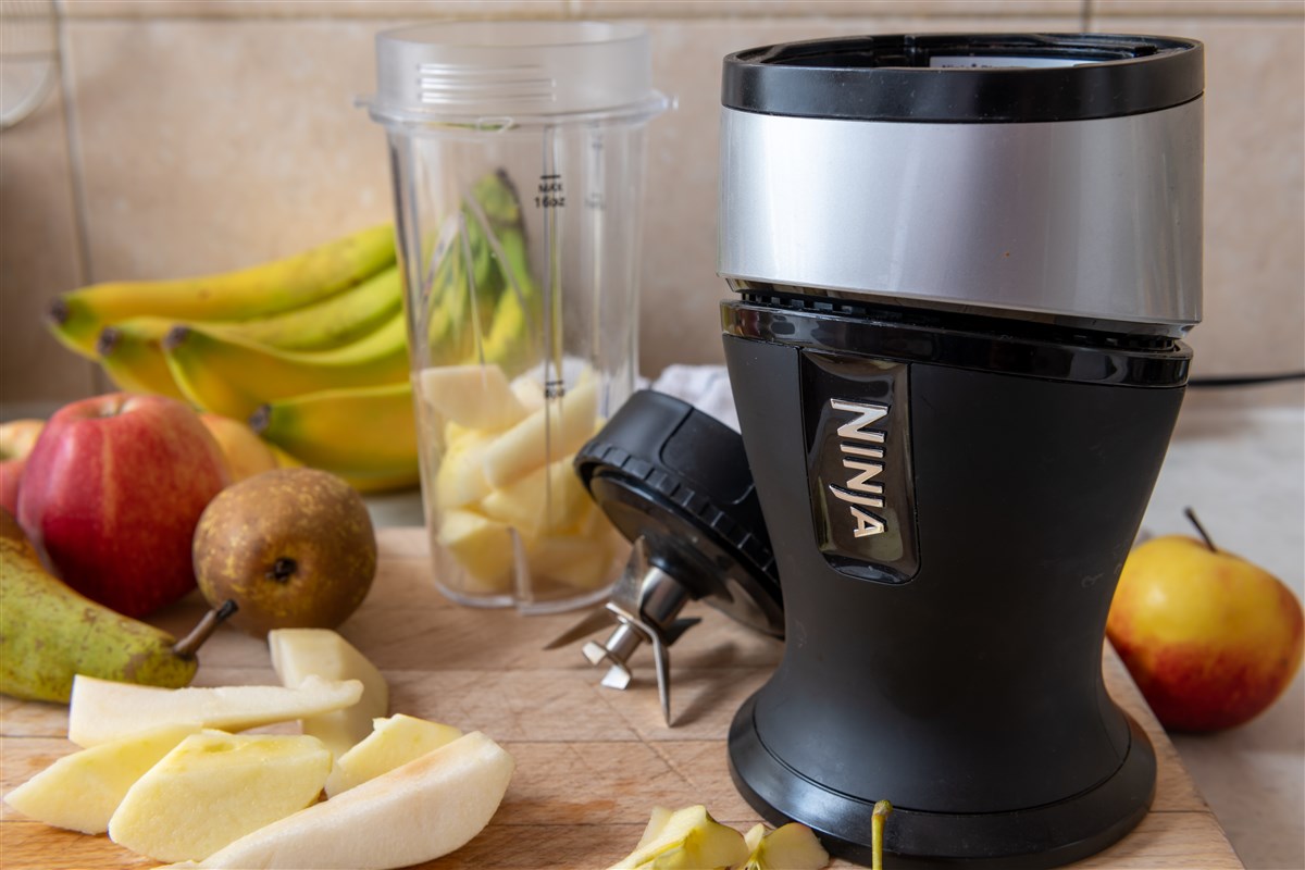 close-up image of blue ninja blender with various fruits