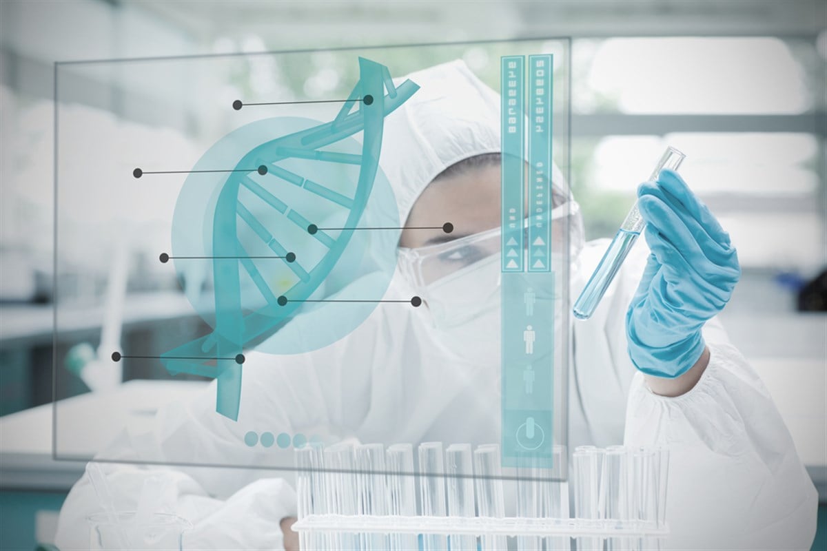 Chemist working with blue liquid and futuristic interface showing DNA diagram; learn more about 3 biotech stocks worth pursuing