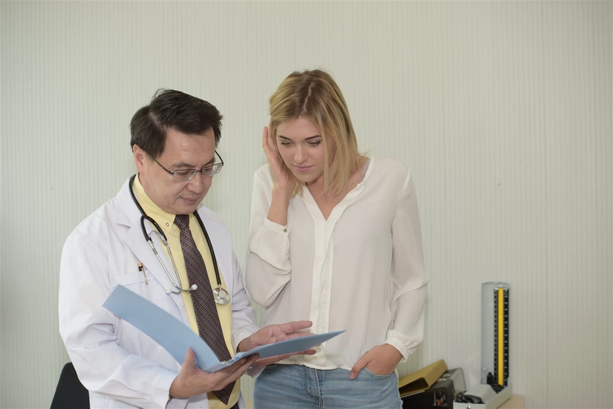 doctor reviewing notes with patient