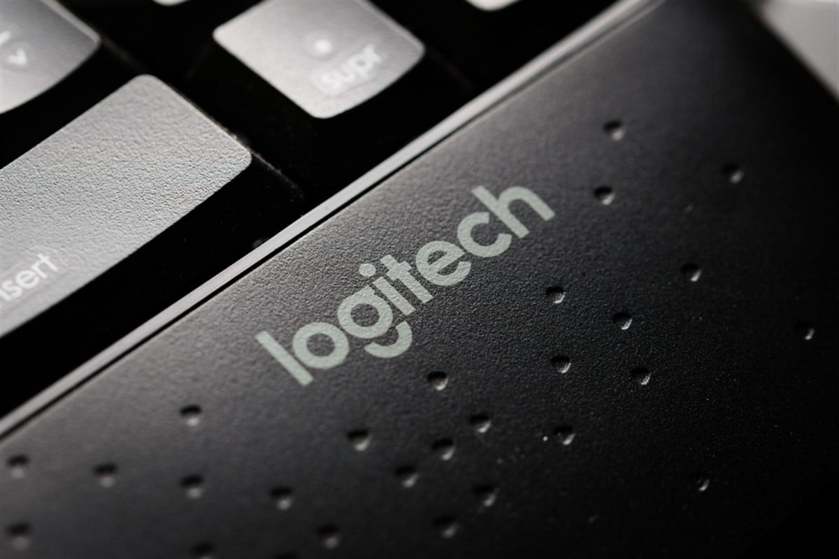 Logitech company brand logo in a modern black keyboard