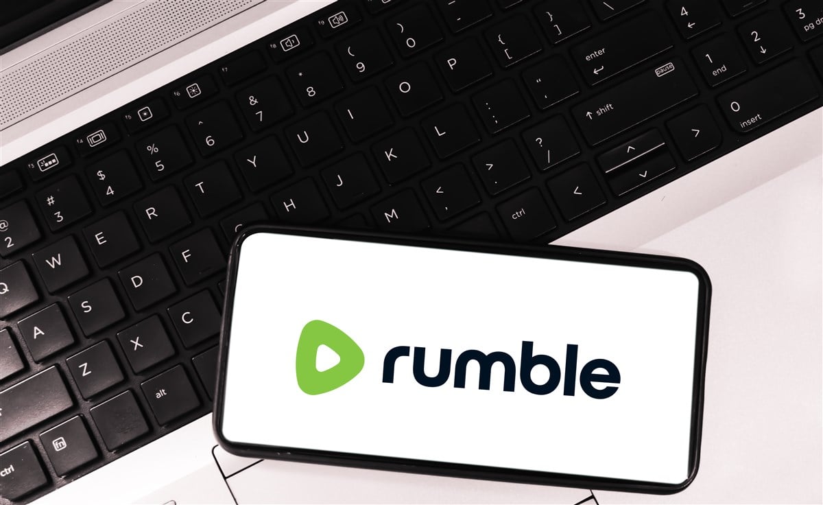 image of rumble logo on mobile device laying on keyboard