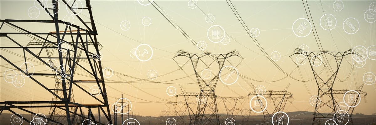 photo of power transmission lines with tech symbols