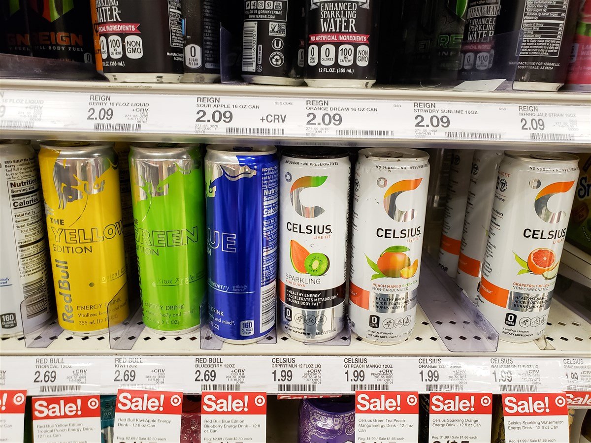 photo of celsius beverage cans inside refrigerated grocery section