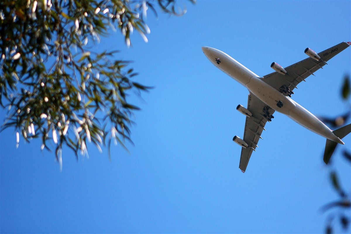image of unbranded jet flying in bright blue skies