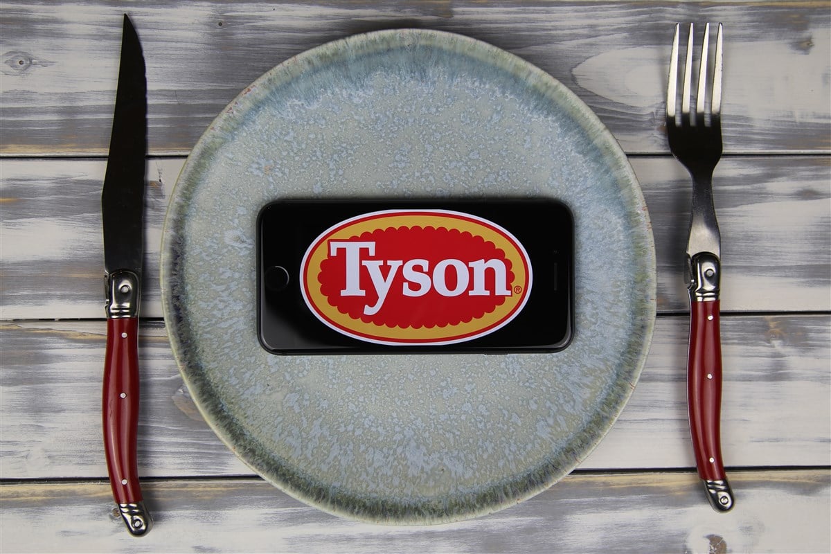 photo of dinner plate with fork and knife and tyson logo displayed on mobile device