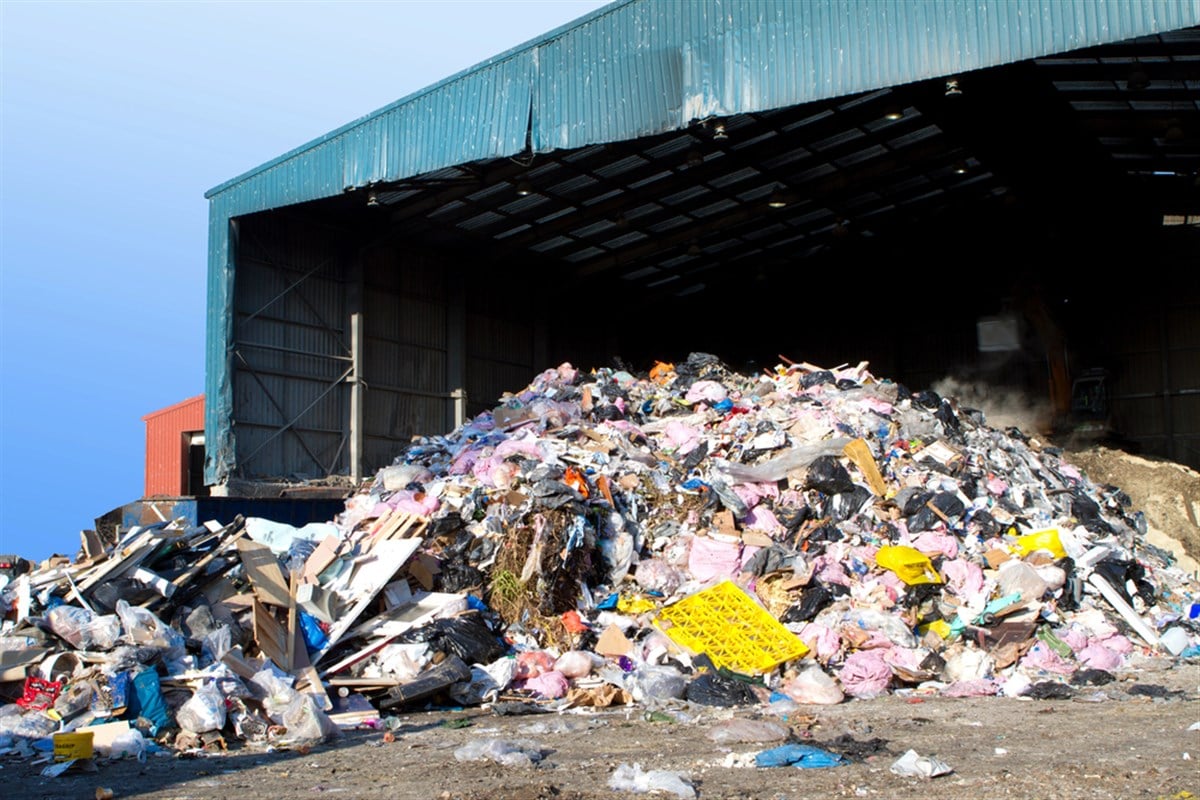 Image of waste in front of a barn