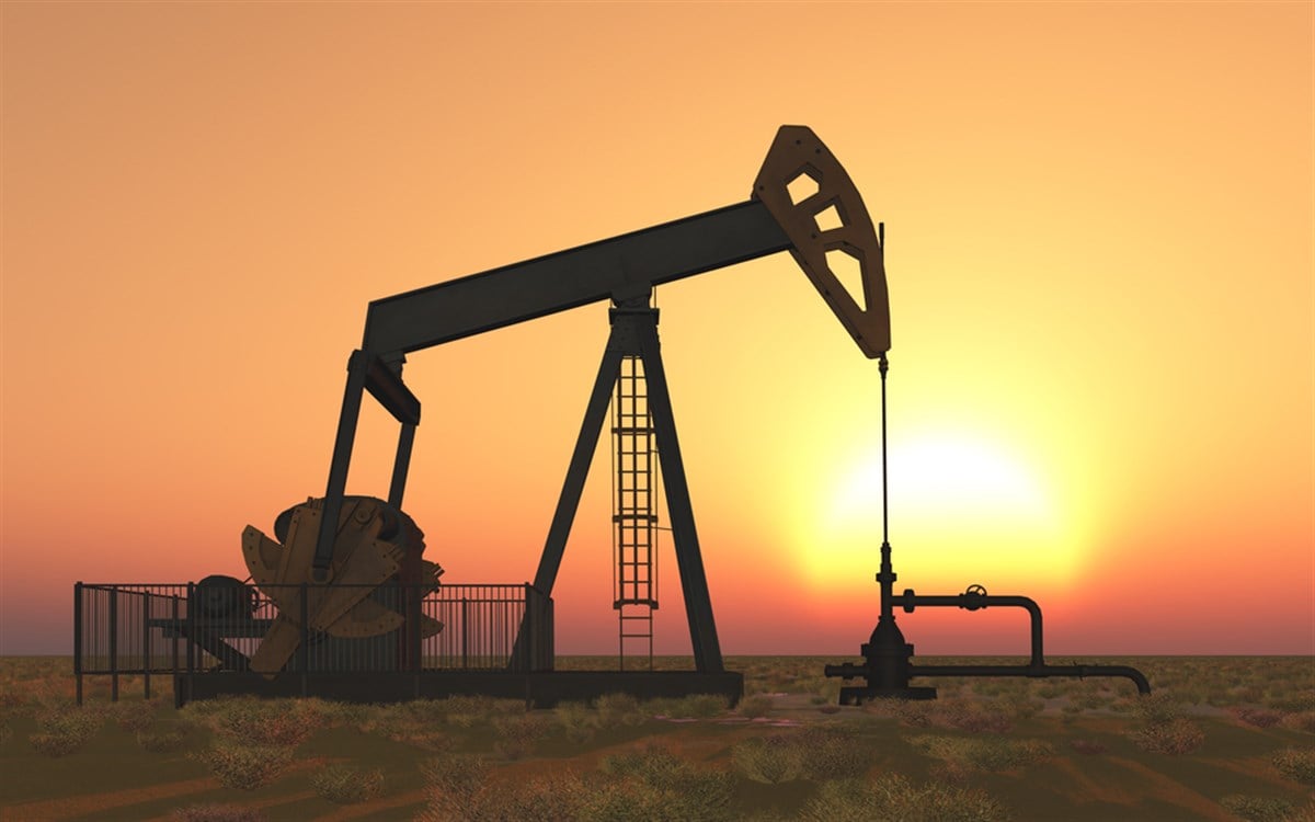 Oil field at sunset image