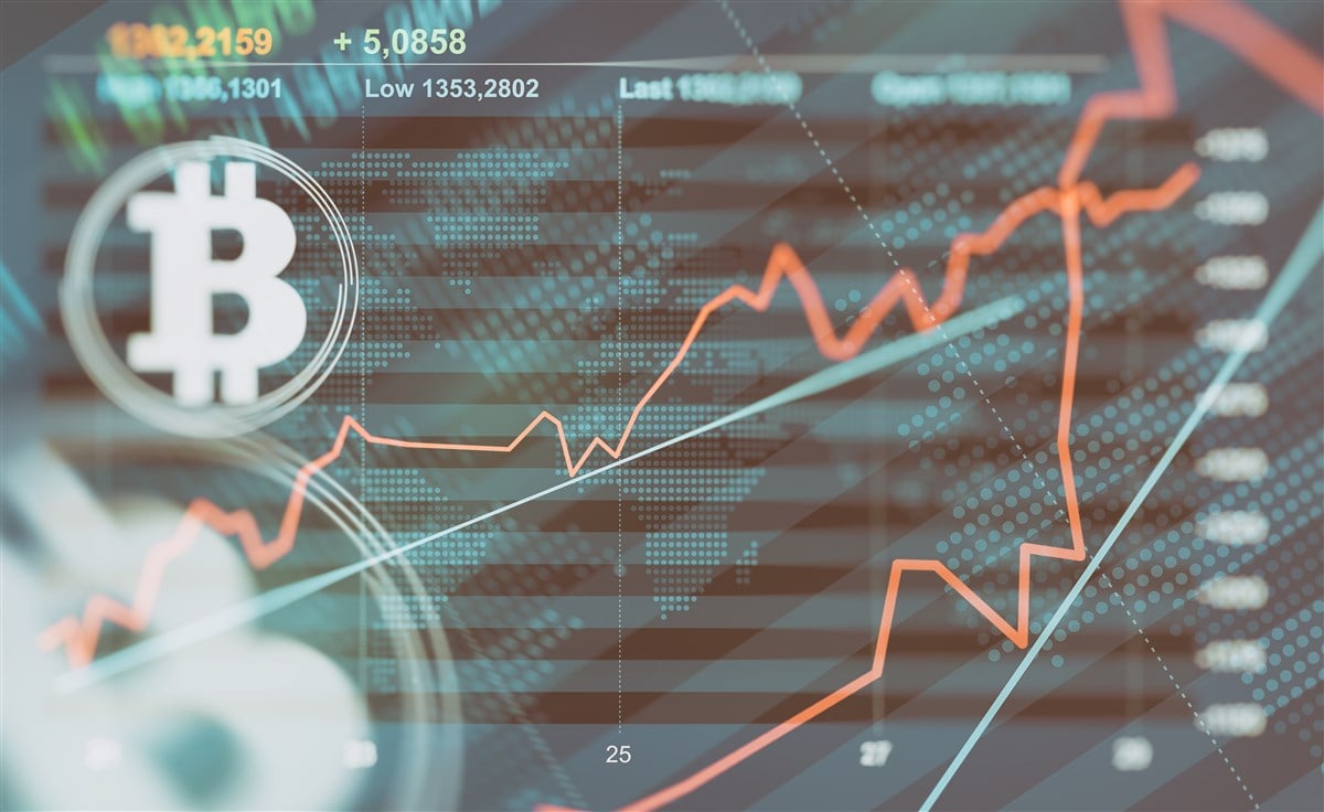 graphic of stock chart with Bitcoin logo in foreground