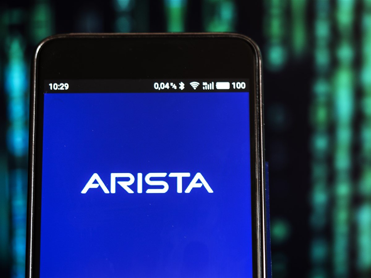 photo of mobile phone with Arista logo on blue background