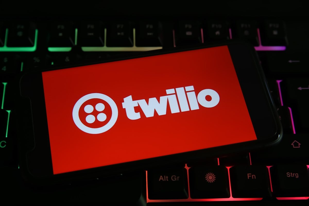 photo of twilio logo on mobile device resting on a computer keyboard