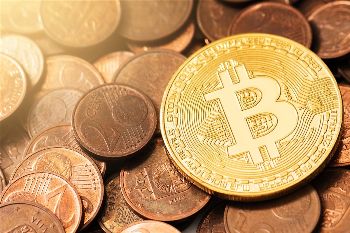 closeup photo of a representation of Bitcoin as a gold coin