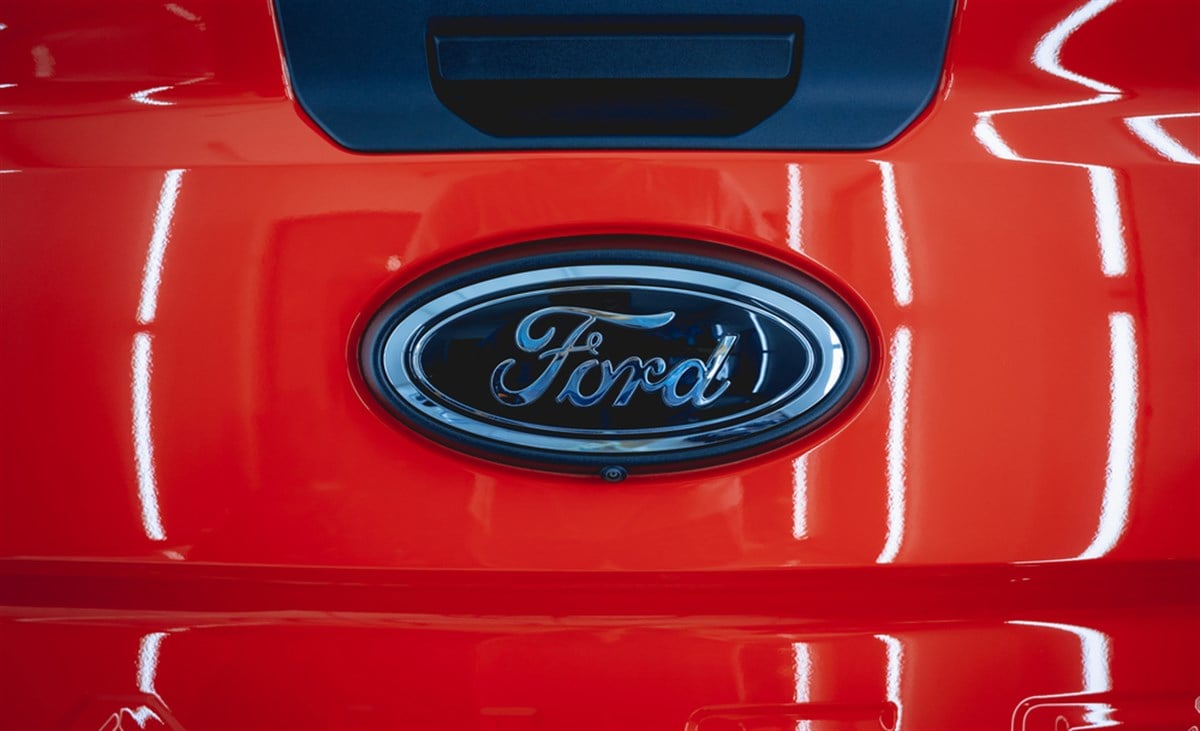 Ford logo on red car, stock price 