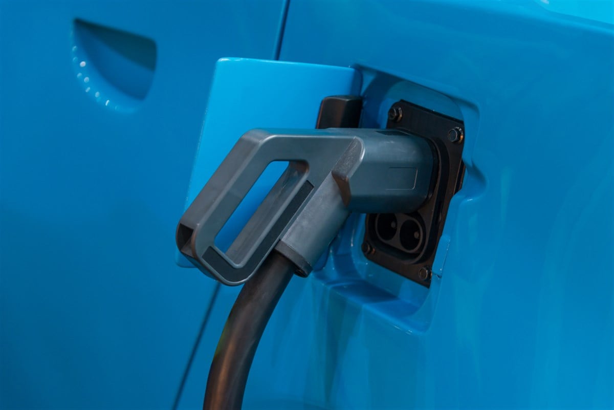 Electric car being charged plug in hybrid charging station for electric vehicles new automotive Innovations, the charging the battery for the car, Future of transportation, Eco car concept